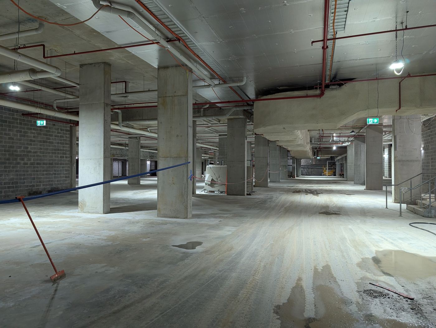 Basement car park with hydraulic and fire services installed overhead
