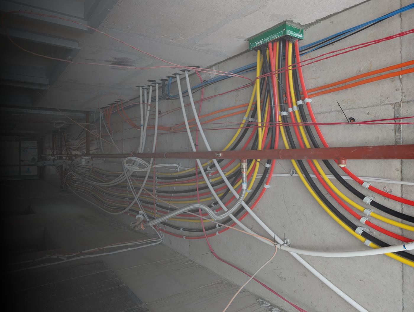 Colour-coded hydraulic and fire services running through a ceiling void