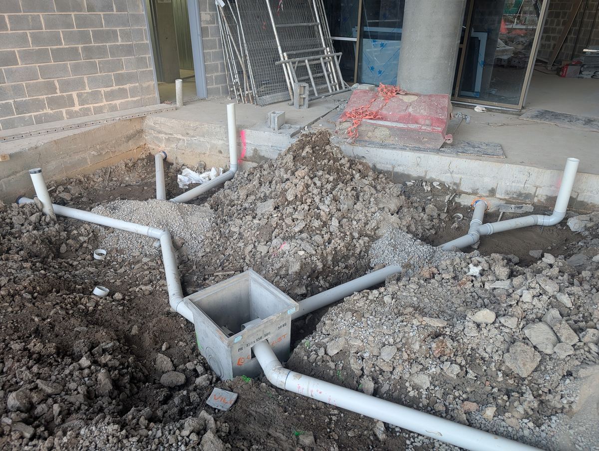 Underground drainage works at a co-living site